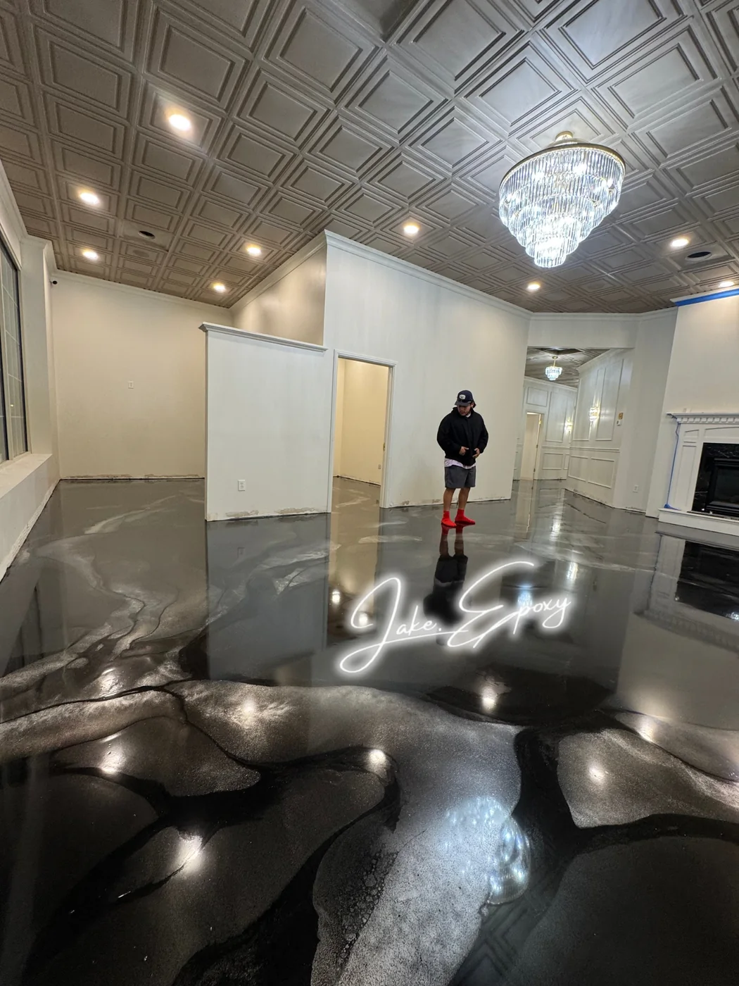 Black metallic epoxy floor with glossy reflection