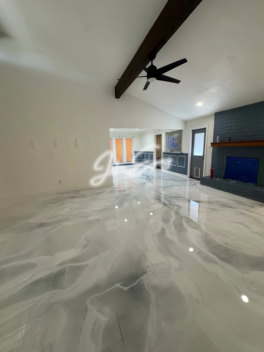 White metallic epoxy living room floor