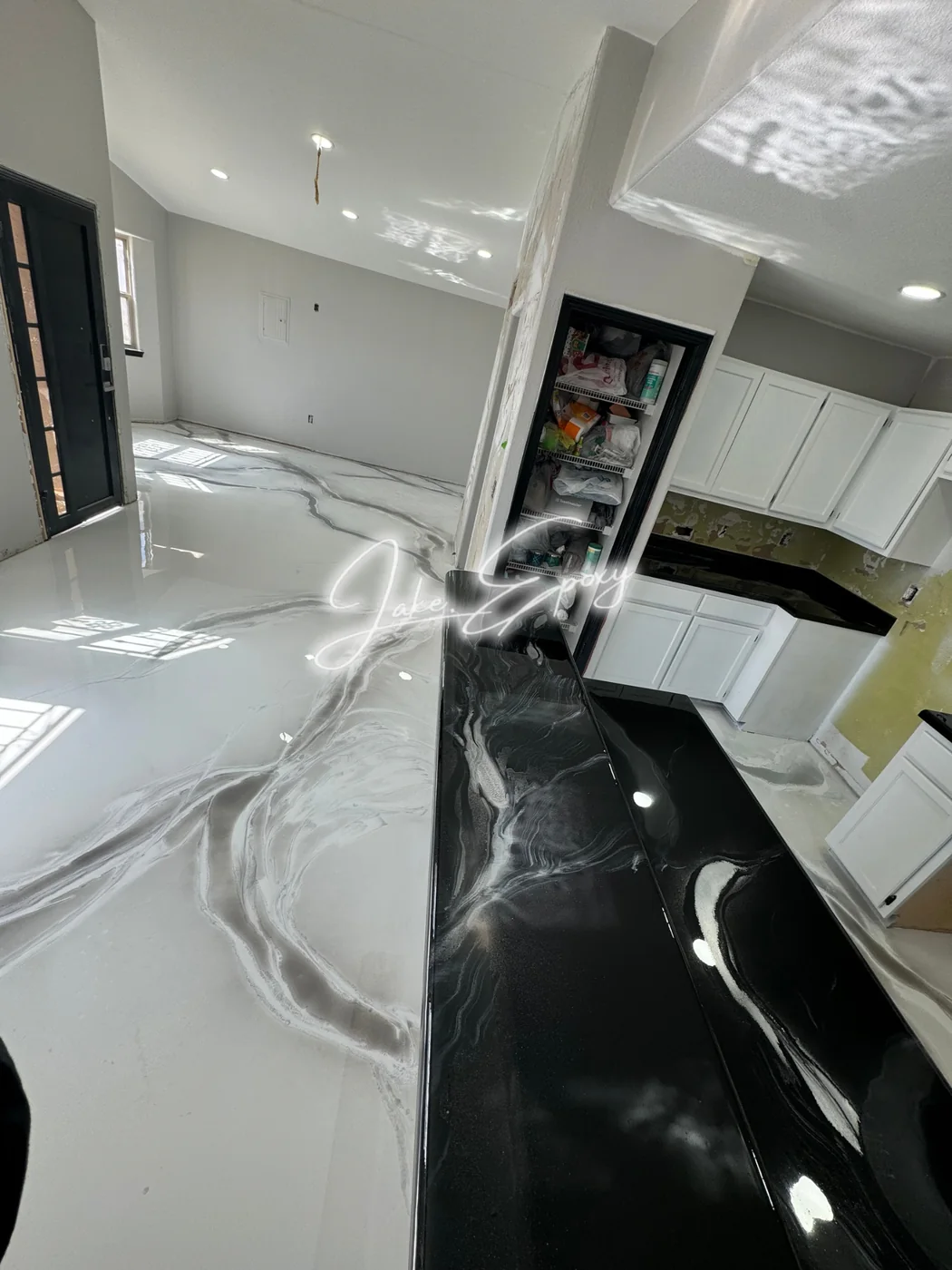 White and black metallic epoxy contrast floor