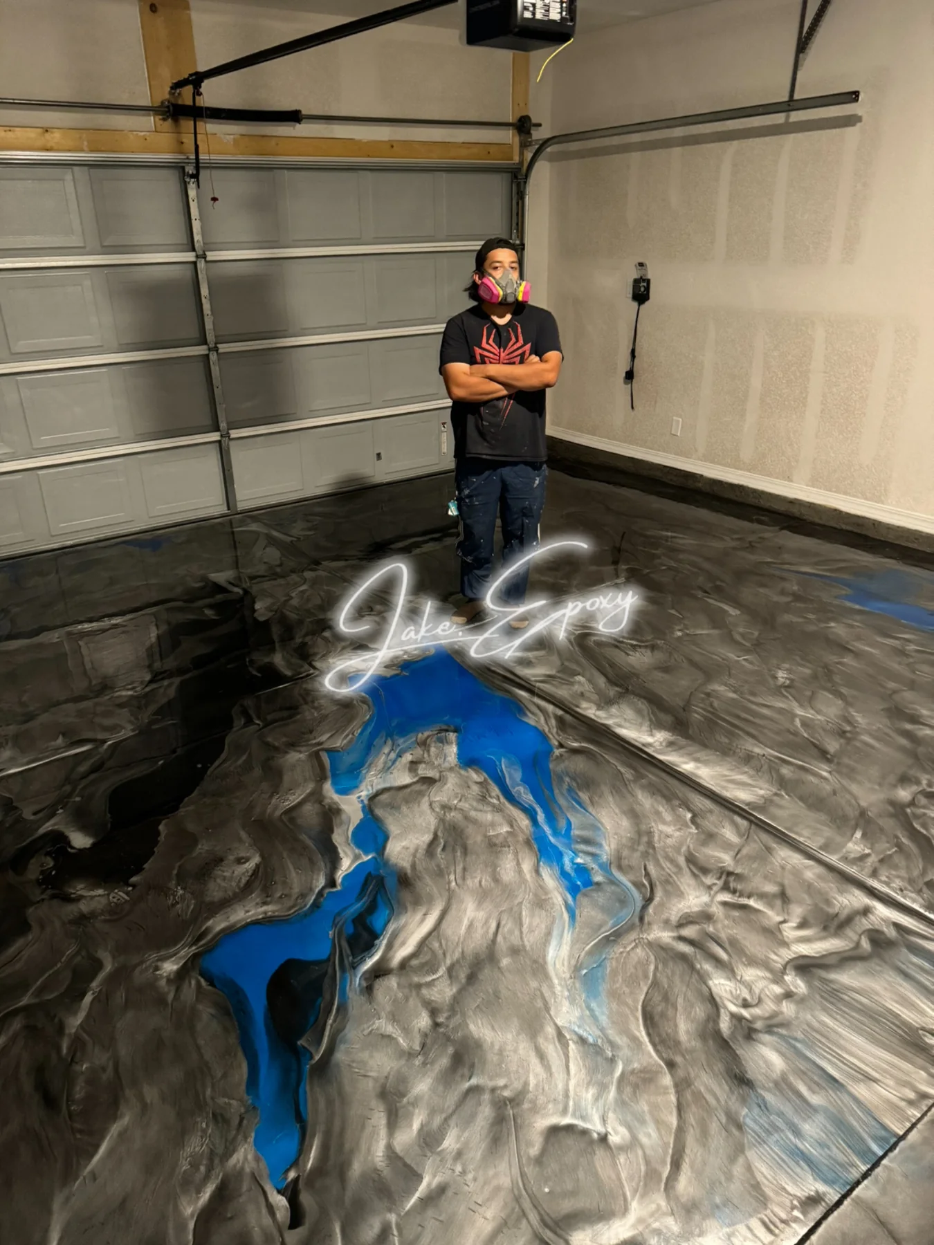 Blue and black metallic epoxy garage floor