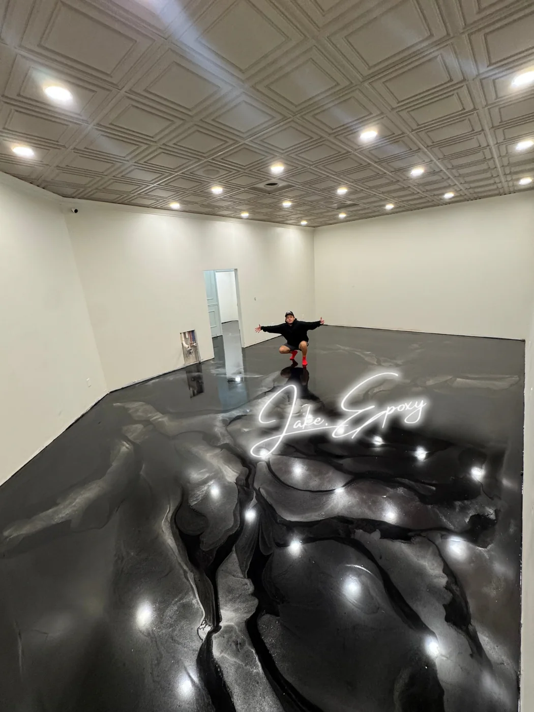 Large room with black metallic epoxy floor