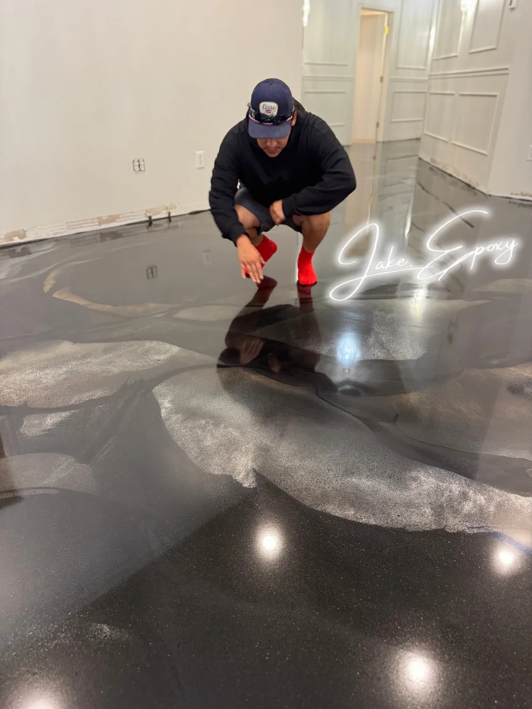 Close-up of black metallic epoxy floor being finished